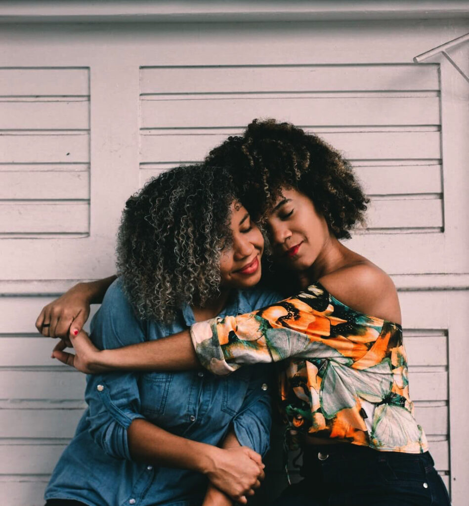 Mother and daughter hugging
